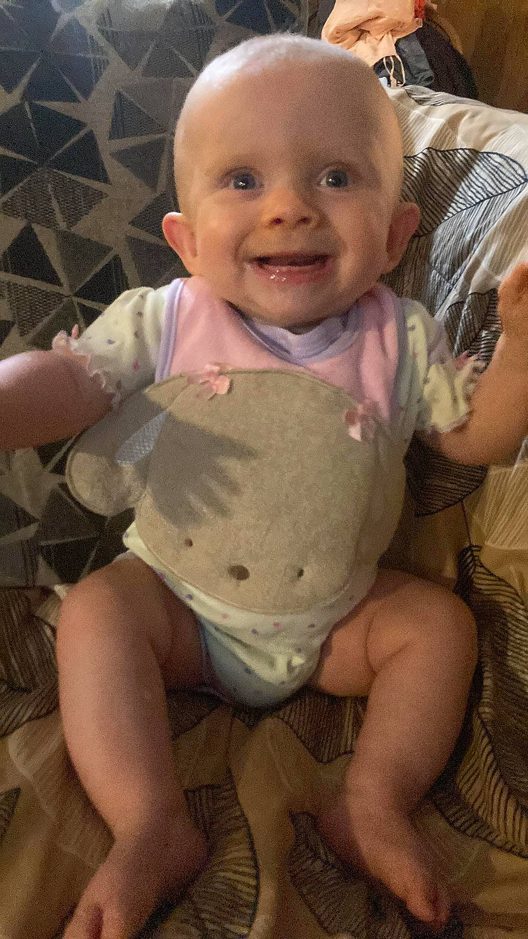 Serenity is registered to the contest to win money with this photo: baby, baby_toddler_clothing, cheek, chest, chin, eye, finger, gesture, happy, human_body, iris, joy, mouth, neck, nose, person, skin, sleeve, smile, stomach