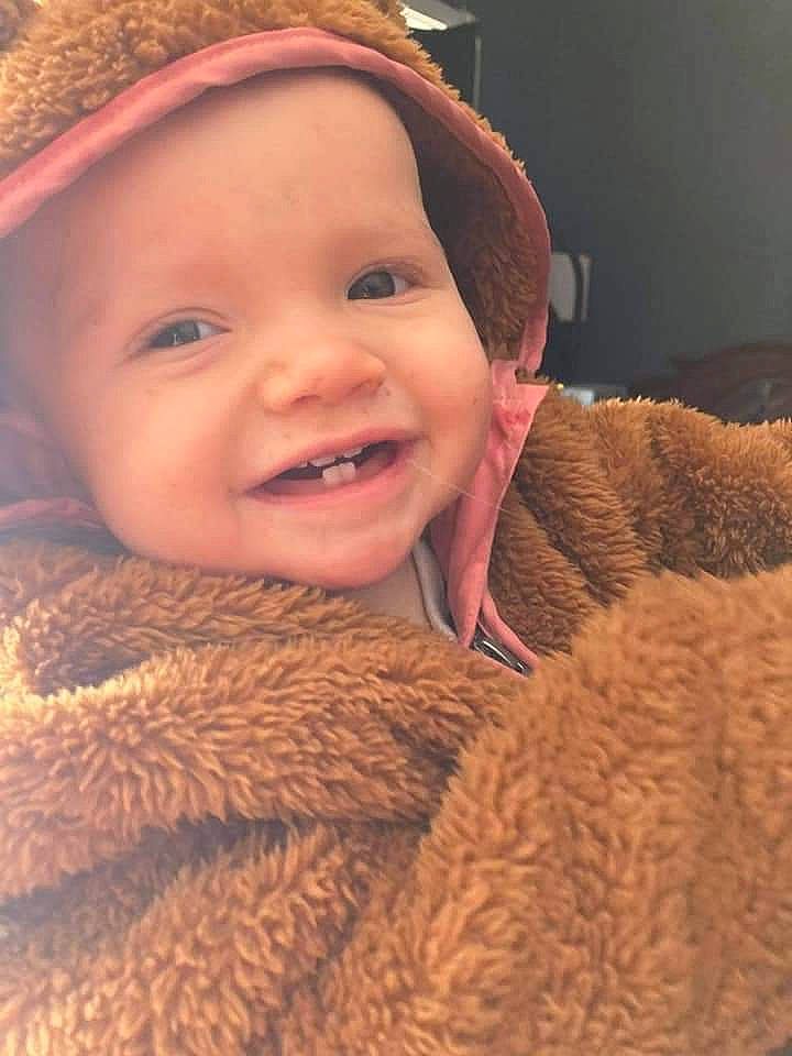 Heavenly Joy Tucker is registered to the contest to win money with this photo: baby, cap, cheek, chin, eye, eyebrow, face, finger, happy, head, headgear, headwear, iris, joy, lip, mouth, nose, outerwear, person, skin