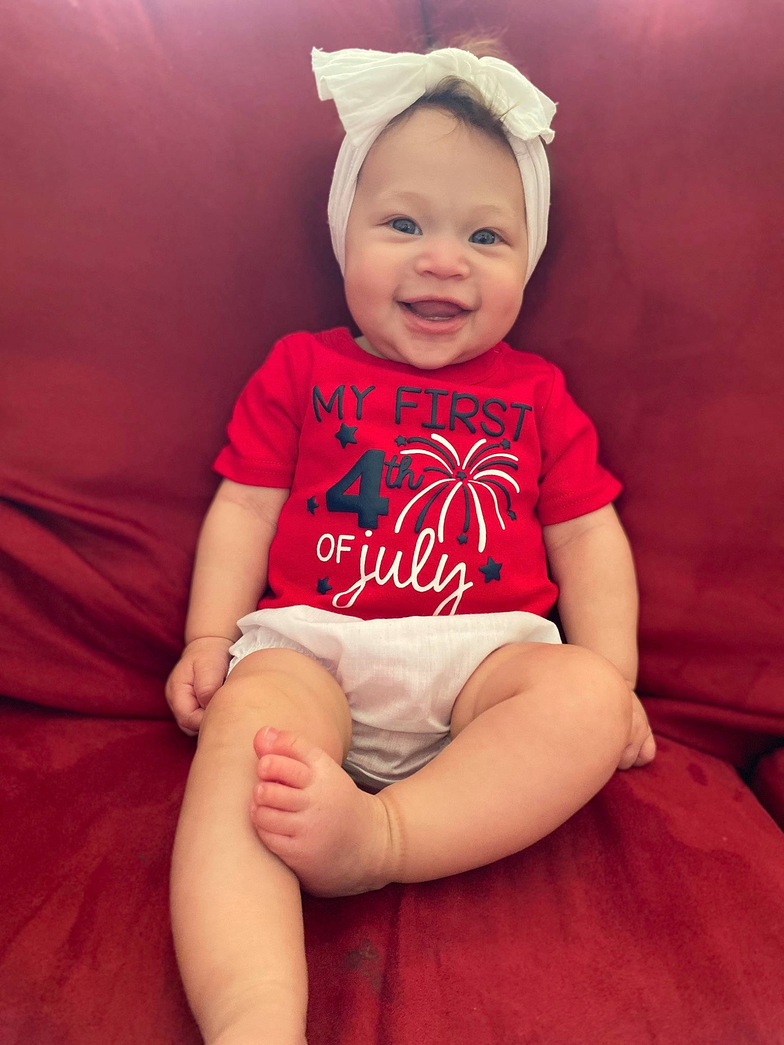 Kailani is registered to the contest to win money with this photo: baby, baby_toddler_clothing, cheek, comfort, cool, eye, finger, happy, head, knee, lip, mouth, neck, person, pink, skin, sleeve, smile, stomach, thigh
