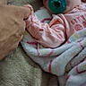 Layla Renee joined the competition — help win amazing prizes! baby, pacifier, blanket, sleeping, hand, adult_hand, infant, soft_texture, cozy, bed, clothing, pink, person, newborn, tender, closeup, cute, resting, human, skin