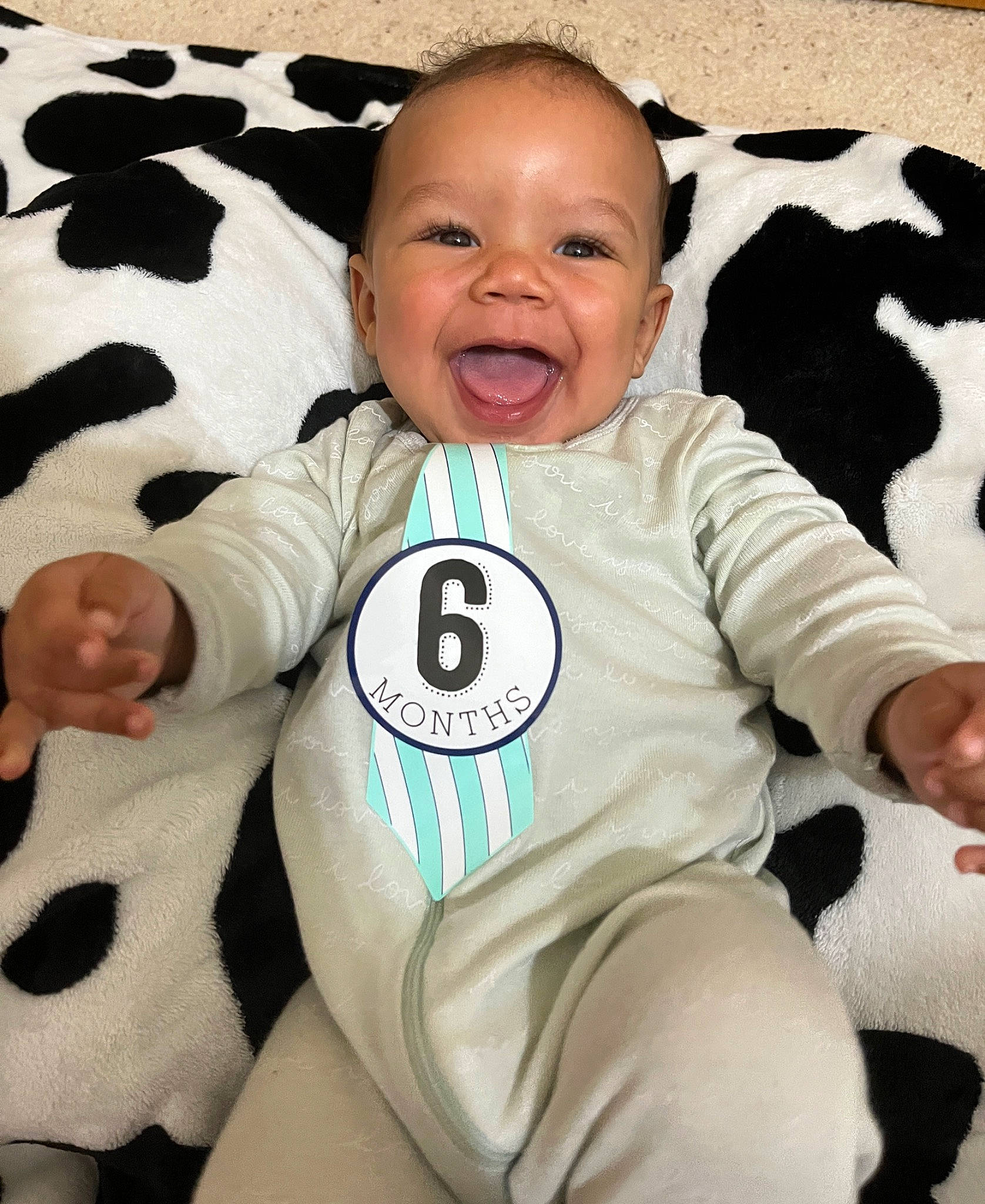 Dakota is registered to the contest to win money with this photo: baby, baby_toddler_clothing, cheek, child, comfort, cool, eye, finger, gesture, happy, head, linens, outerwear, person, skin, sleeve, smile, t_shirt, textile, thumb