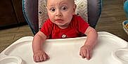 Braxton joined the competition — help win amazing prizes! baby, child, curious, door, expression, feeding, flooring, furniture, hands, high_chair, home, indoor, infant, living_room, messy_face, person, plastic, red_shirt, seat, window
