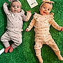 baby, infant, twin, pajamas, headband, carpet, green, milestone_card, lying_down, cute, smiling, happy, child, floor, indoors, person, portrait, clothing, sock, baby_girl