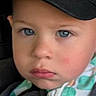 toddler, child, face, blue_eyes, black_cap, jacket, young, portrait, closeup, serious_expression, person, clothing, indoor, baby, headwear, cute, fashion, person_head, young_child, baby_face