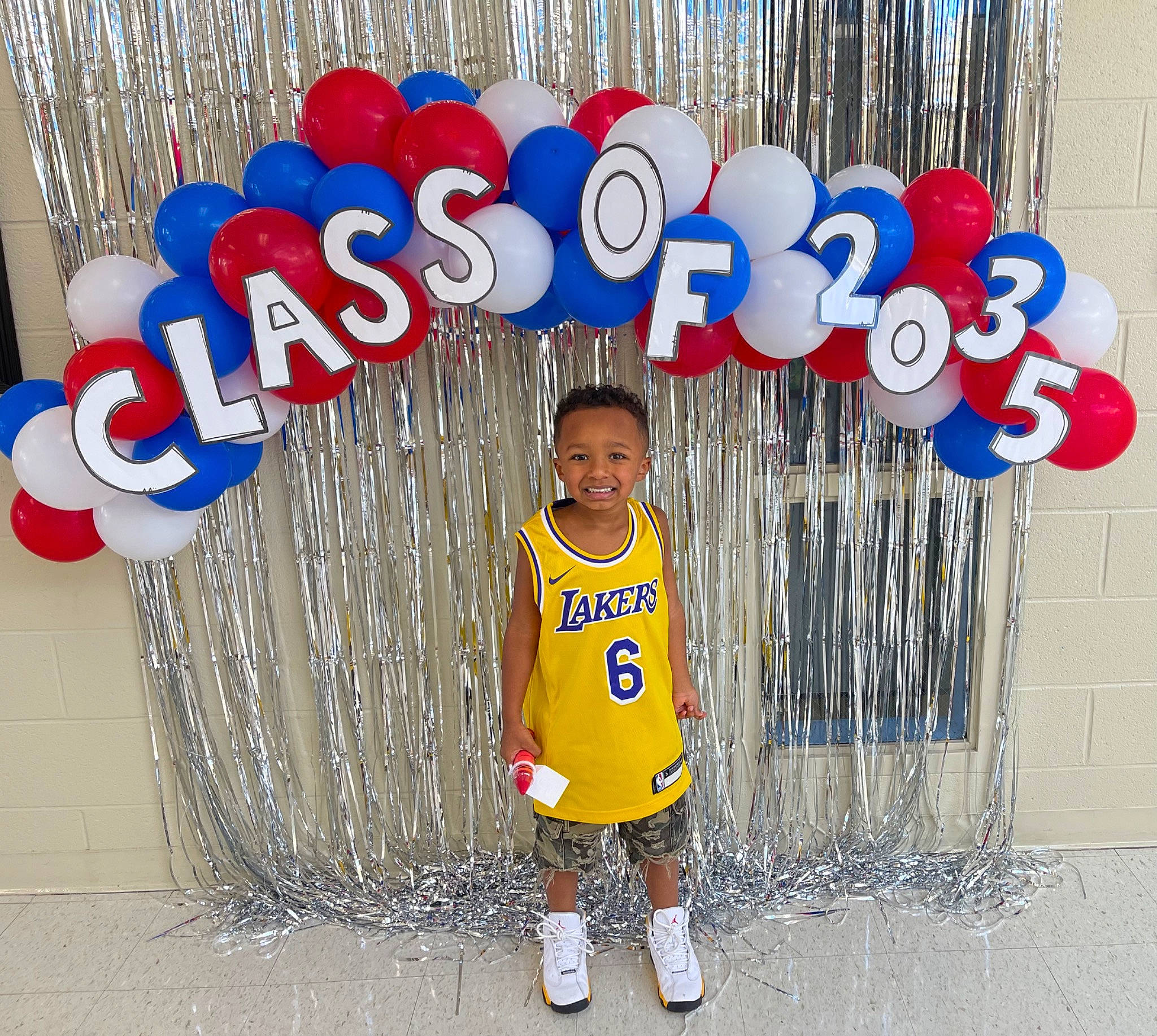 Tavion is registered to the contest to win money with this photo: child, design, electric_blue, fence, font, fun, gas, happy, joy, leisure, logo, people, person, play, product, sign, signage, sleeve, smile, t_shirt
