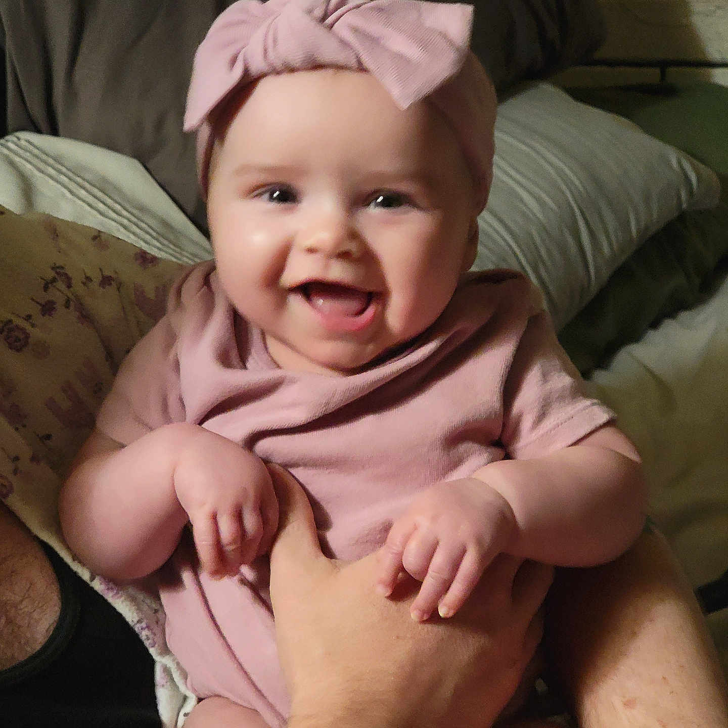 Amira joined the competition — help win amazing prizes! baby, babylaughing, bodypart, bonnet, clothing, couch, face, finger, furniture, hand, happy, hat, head, laughing, newborn, person, photography, portrait, sitting, smile