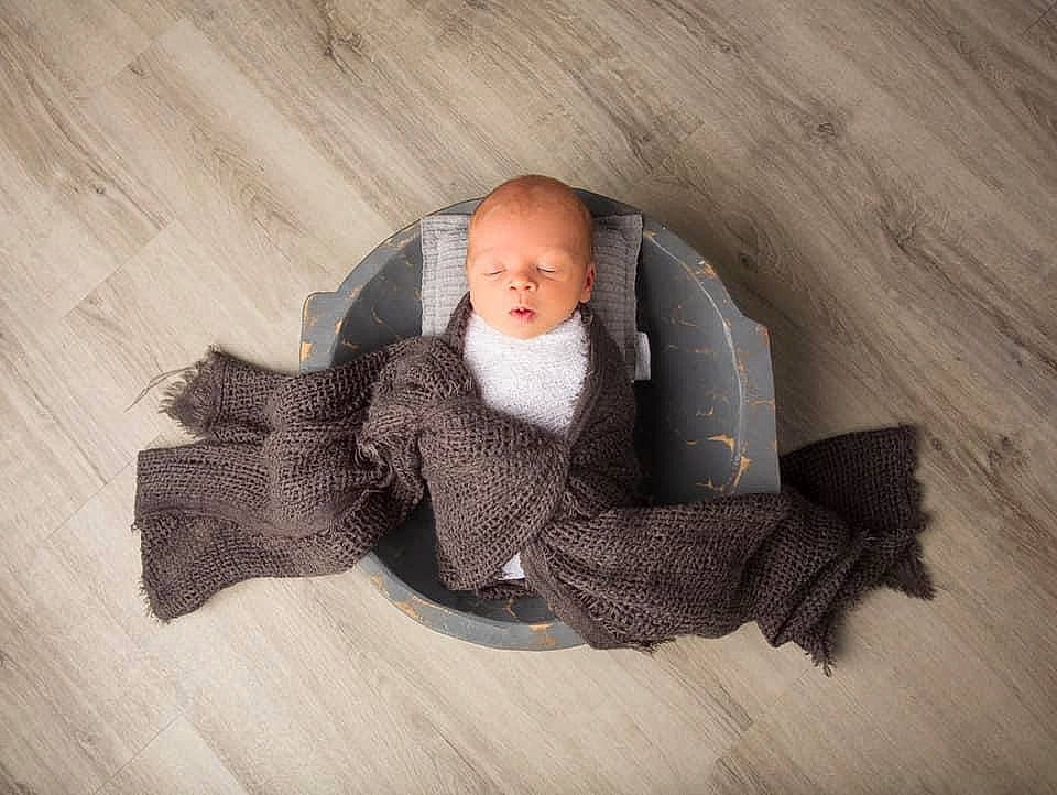 Julian joined the competition — help win amazing prizes! baby, baby_products, baby_toddler_clothing, comfort, floor, flooring, grey, hardwood, headgear, human_body, linens, outerwear, pattern, person, sitting, sleeve, textile, toddler, wood, wool