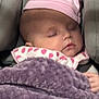 baby, blanket, car_seat, cheeks, child, closed_eyes, cozy, face, hand, indoors, infant, nap, newborn, peaceful, pink_hat, polka_dot_bib, portrait, purple_blanket, sleeping, soft_texture
