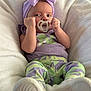 Aaliyah joined the competition — help win amazing prizes! baby, bed, blanket, bodypart, bonnet, clothing, couch, cushion, face, finger, furniture, hand, hat, head, homedecor, newborn, person, photography, portrait, purple