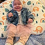 Aaliyah is registered to the contest to win money with this photo: baby, bonnet, cap, clothing, coat, couch, cushion, face, footwear, furniture, hat, head, homedecor, jacket, pants, person, photography, portrait, shoe, sitting