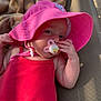 Ambre participe au concours pour gagner de l'argent avec cette photo : baby, infant, pink_hat, pacifier, red_clothing, blanket, lounge_chair, water_bottle, outdoor, sunlight, relaxing, child, cute, skin, hand, face, portrait, summer, shade, daylight