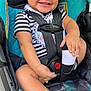 baby, child, car_seat, smiling, striped_clothing, socks, seatbelt, happy, infant, cute, safety, indoor, person, portrait, hands, legs, footwear, young_child, seat, baby_clothes