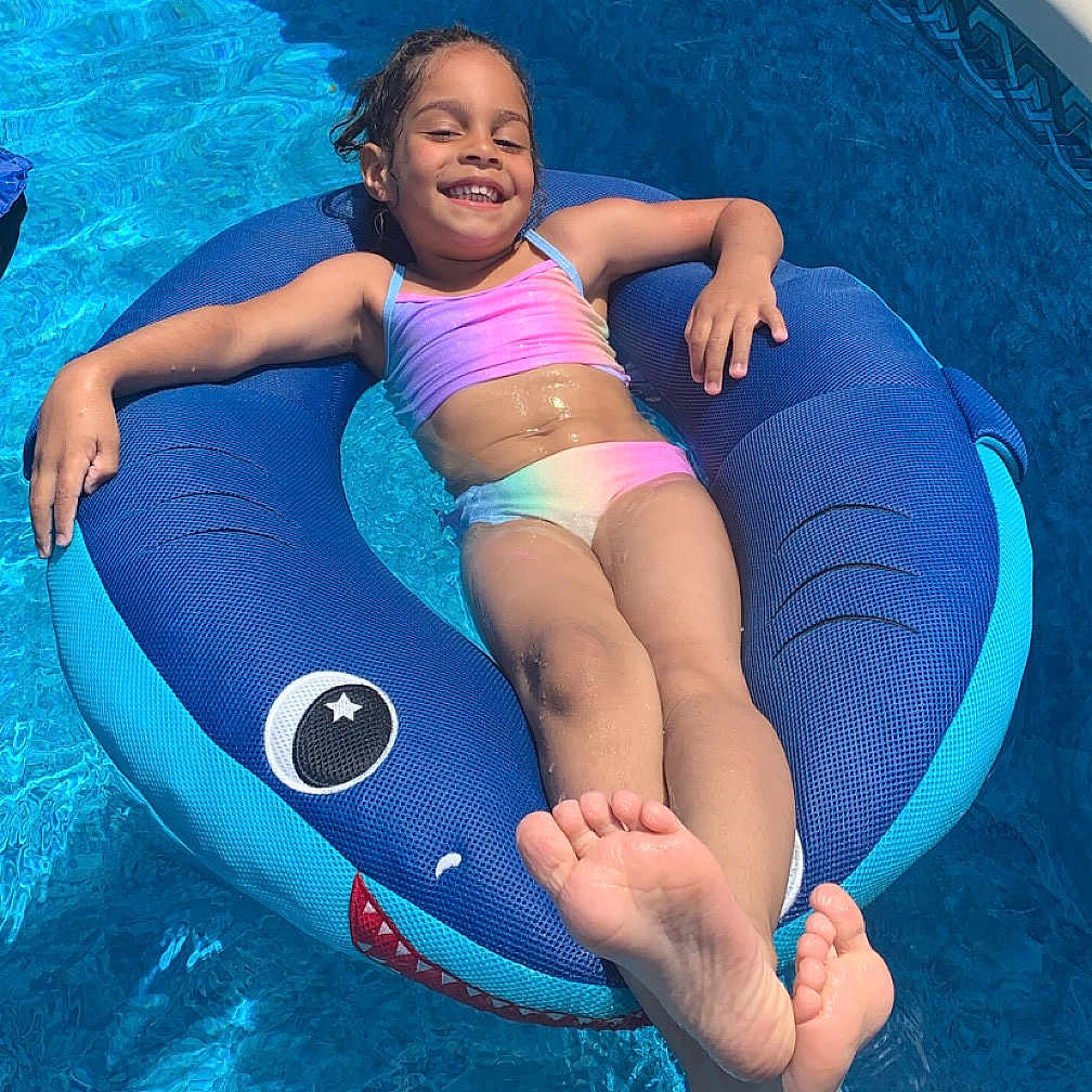 Adaleah joined the competition — help win amazing prizes! baby, clothing, face, head, leisureactivities, lifejacket, outdoors, person, photography, pool, portrait, shorts, sport, summer, swimming, swimmingpool, swimwear, vest, water, watersports