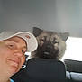 Urus participe au concours pour gagner de l'argent avec cette photo : animal, backseat, blurry, cap, car, casual, companion, dog, face, furry, head, indoor, light, person, pet, portrait, seat, smile, vehicle, window