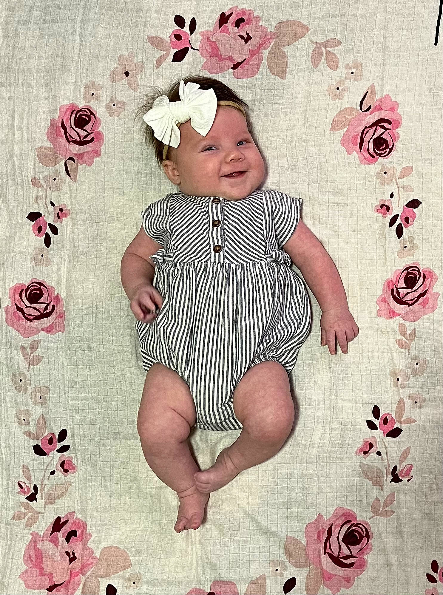Maylee is registered to the contest to win money with this photo: art, baby, baby_toddler_clothing, cheek, flower, font, happy, headwear, illustration, linens, magenta, pattern, person, petal, pink, product, sleeve, smile, t_shirt, textile