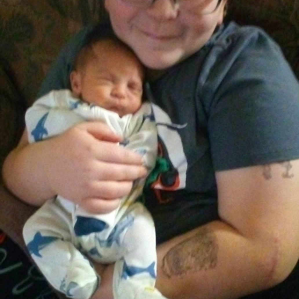 Cazmair joined the competition — help win amazing prizes! baby, child, clothing, comfort, couch, family, glasses, happy, holding, home, indoor, infant, onesie, person, portrait, shark_pattern, sleeping, smile, toddler, young