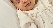 Brooke joined the competition — help win amazing prizes! baby, blanket, child, closeup, clothing, cozy, cute, flower, headband, infant, newborn, peaceful, pillow, pink, portrait, resting, sleeping, soft, white, young