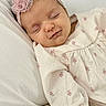 Brooke joined the competition — help win amazing prizes! baby, sleeping, infant, headband, flower, pink, white, pillow, blanket, clothing, cute, peaceful, resting, closeup, portrait, child, soft, cozy, newborn, young