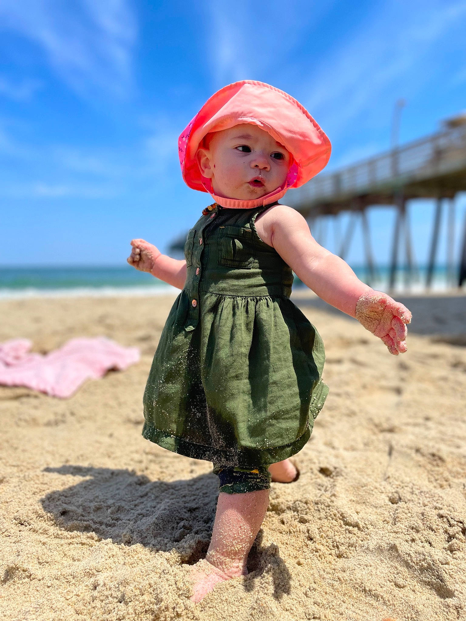 Helen joined the competition — help win amazing prizes! beach, cap, child, cloud, fashion_accessory, fawn, fun, grass, happy, headwear, landscape, ocean, pattern, people_in_nature, person, pink, sand, sky, soil, toddler