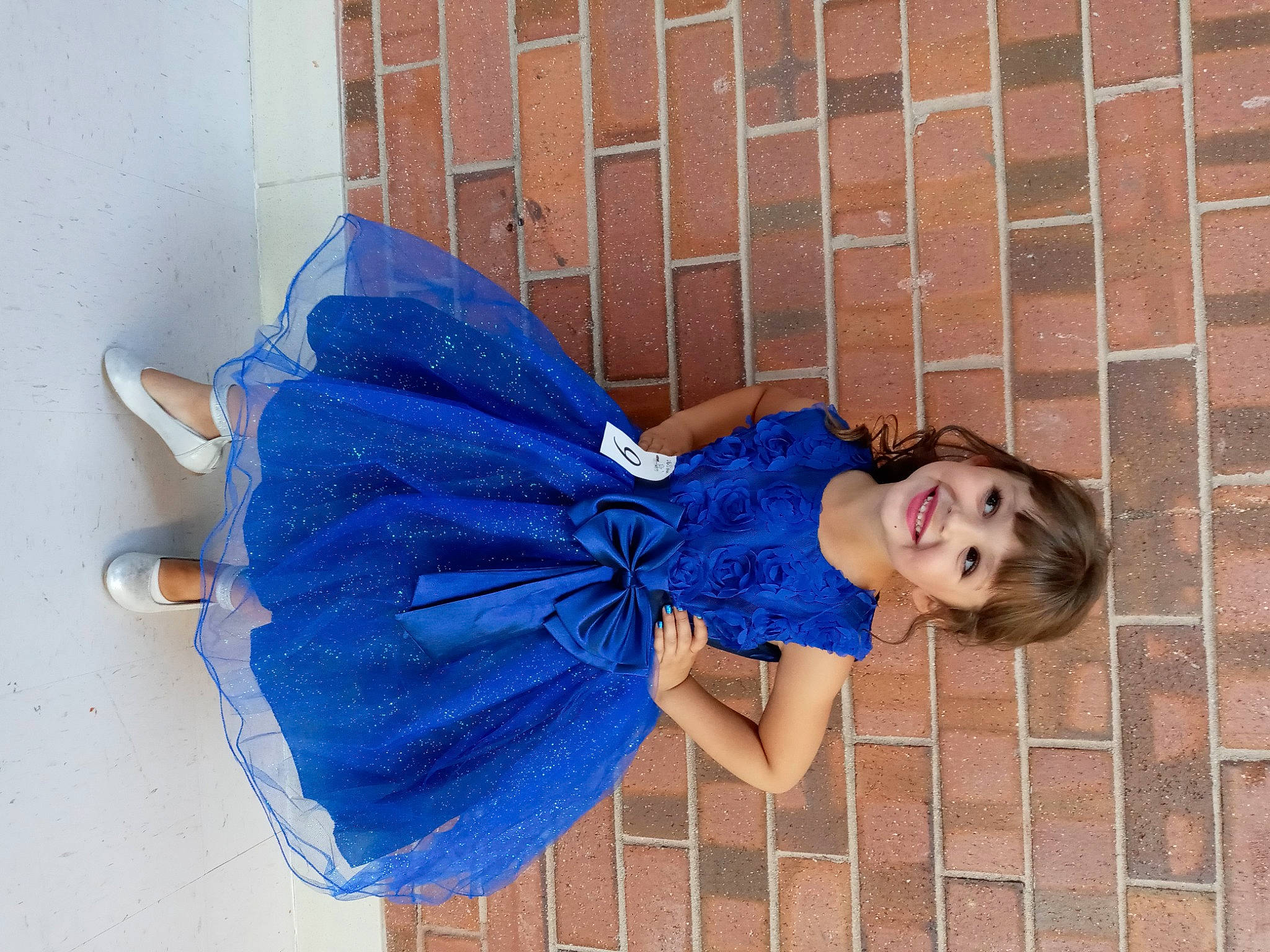 Kwynn is registered to the contest to win money with this photo: blue, brick, child, cocktail_dress, costume, day_dress, denim, dress, electric_blue, fashion_accessory, happy, headgear, human_leg, joy, magenta, pattern, person, photo_shoot, portrait_photography, shoulder