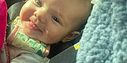 Havenleigh joined the competition — help win amazing prizes! baby, infant, smiling, car_seat, seat_belt, blanket, fabric, warning_label, portrait, closeup, cheek, eyes, tongue, strap, head, onesie, interior, sunlight, hand, cozy