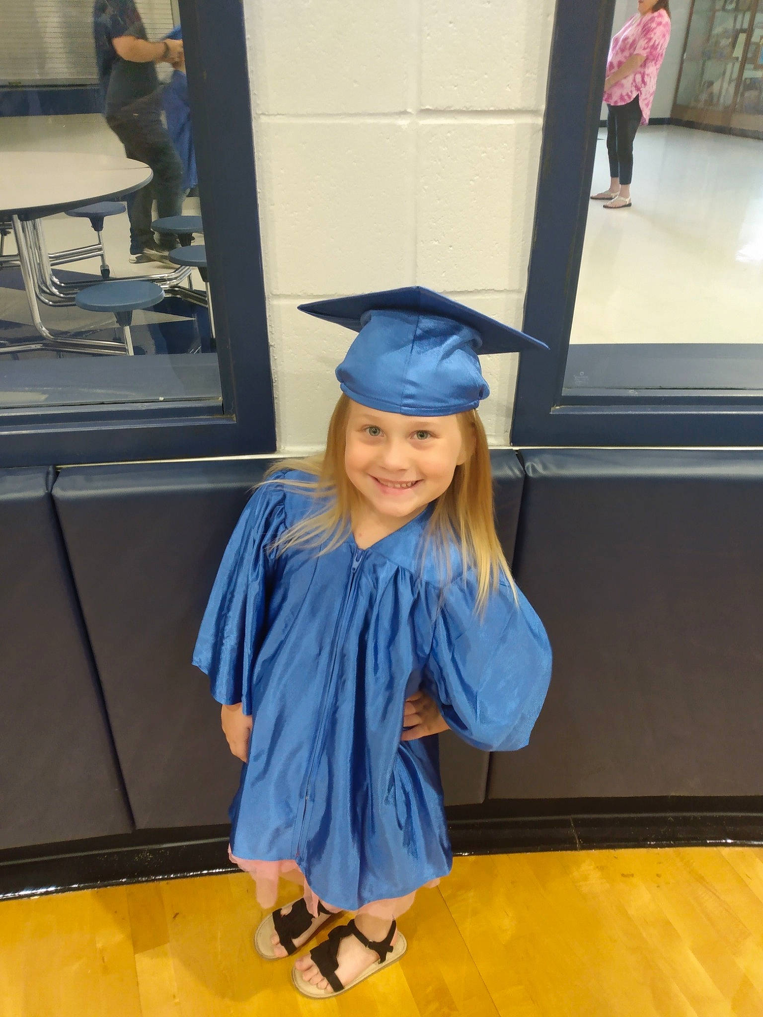 Tessa joined the competition — help win amazing prizes! academic_dress, academic_institution, costume, electric_blue, event, fashion_design, flooring, fun, graduation, happy, hat, headwear, joy, mortarboard, person, phd, recreation, room, scholar, smile