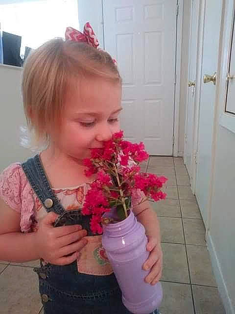 Renee joined the competition — help win amazing prizes! annual_plant, artificial_flower, bouquet, cut_flowers, door, event, floral_design, flower, flower_arranging, flowerpot, happy, magenta, person, petal, pink, plant, plastic_bottle, rose, skin, smile