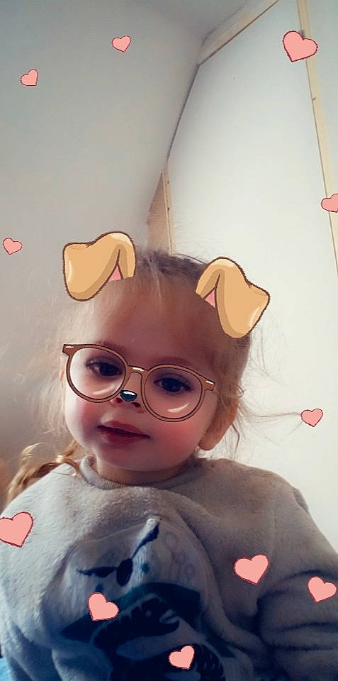 Enola participe au concours pour gagner de l'argent avec cette photo : cap, chin, doll, ear, eyebrow, eyelash, eyewear, face, gesture, hairstyle, happy, head, iris, lip, mouth, nose, person, skin, textile, toy