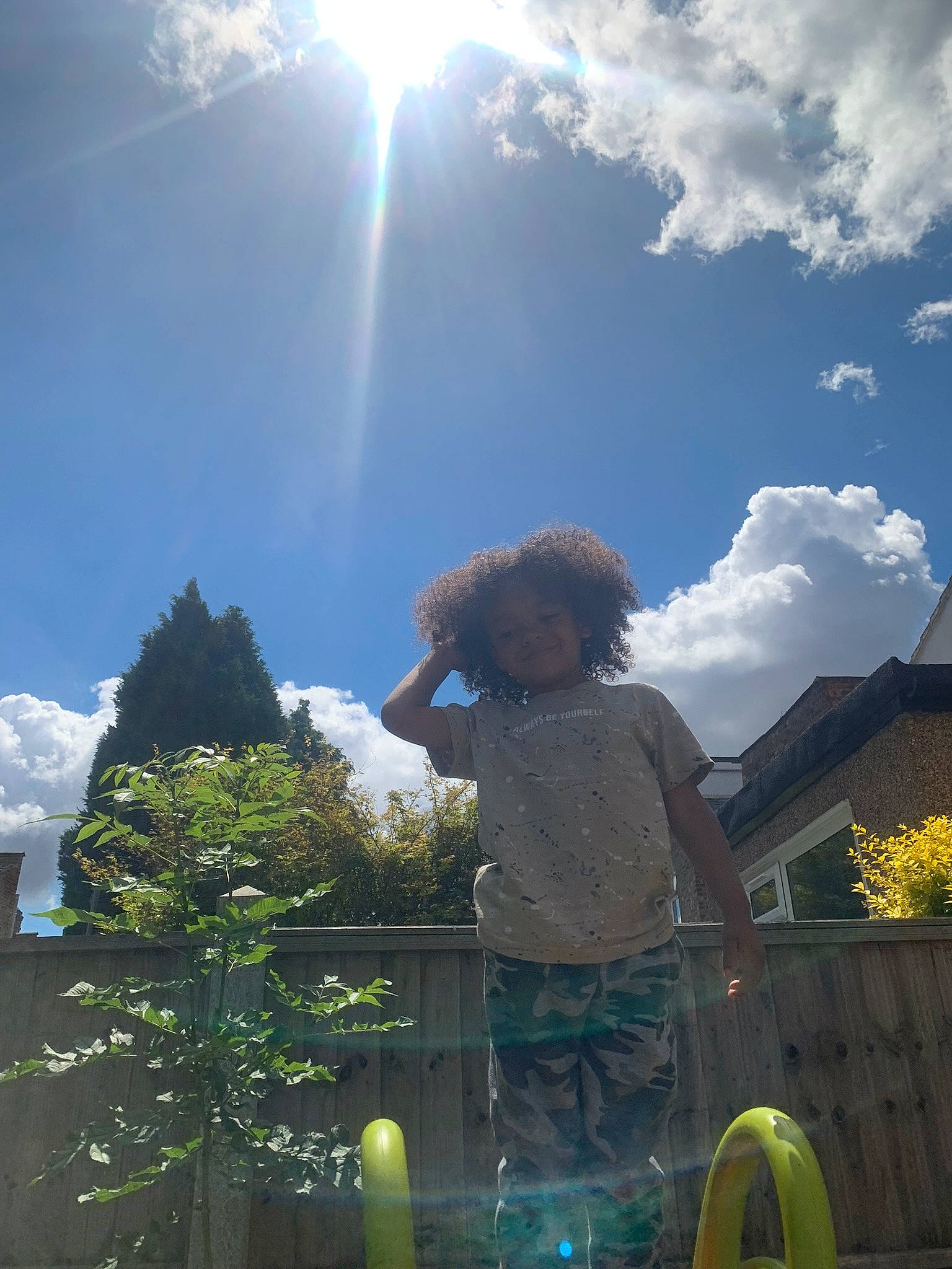 Micah is registered to the contest to win money with this photo: cloud, cumulus, daytime, grass, happy, landscape, leisure, light, lighting, mountainous_landforms, people_in_nature, person, plant, sky, sunlight, tints_and_shades, toddler, travel, tree, under_exposed