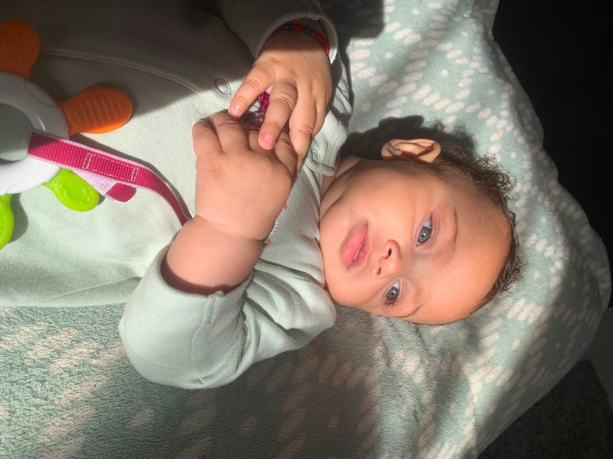 Eva is registered to the contest to win money with this photo: arm, baby, baby_toddler_clothing, child, comfort, finger, fun, gesture, hand, human_body, kitchen_utensil, leg, mouth, nail, nose, person, skin, tableware, thumb, toddler