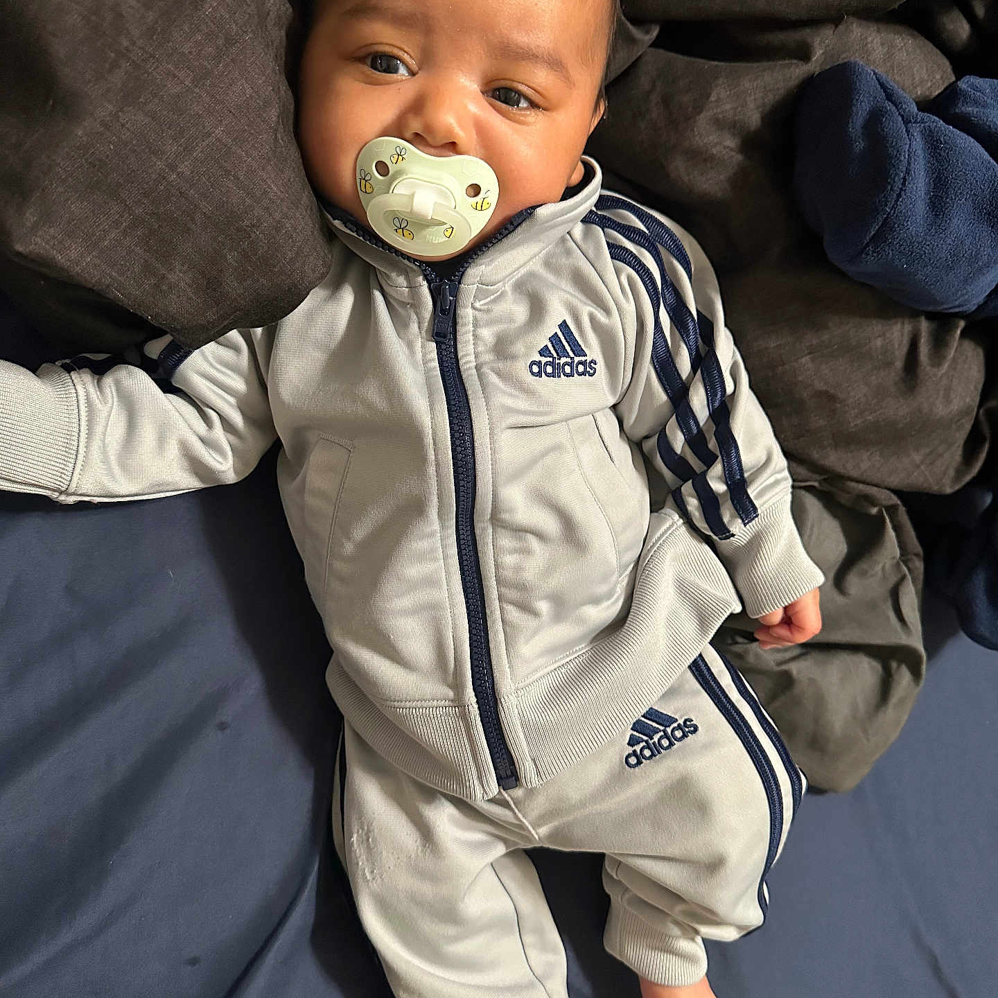 Jiraiya is registered to the contest to win money with this photo: baby, babylaughing, biting, bodypart, clothing, coat, face, finger, hand, happy, head, hood, jacket, pants, person, photography, portrait, sleeve, smile, yawning