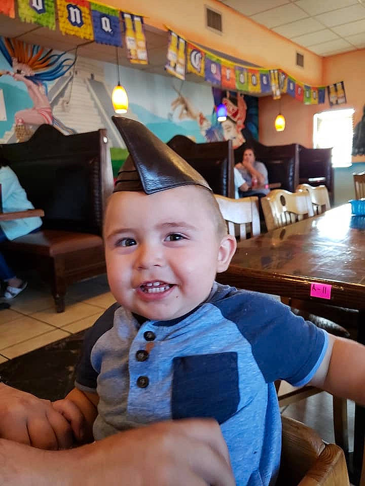 Hakeem joined the competition — help win amazing prizes! baby, blurred, child, fun, joy, person, restaurant, smile, thumb, toddler