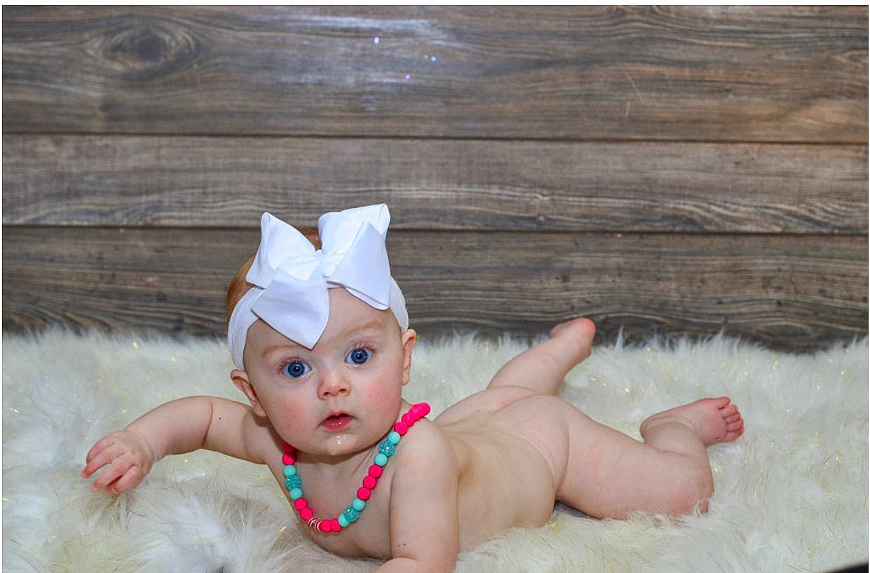 Rayna is registered to the contest to win money with this photo: baby, baby_products, bathing, child, costume_accessory, ear, eye, fashion_accessory, fun, headgear, person, photography, pink, product, skin, surprise, toddler