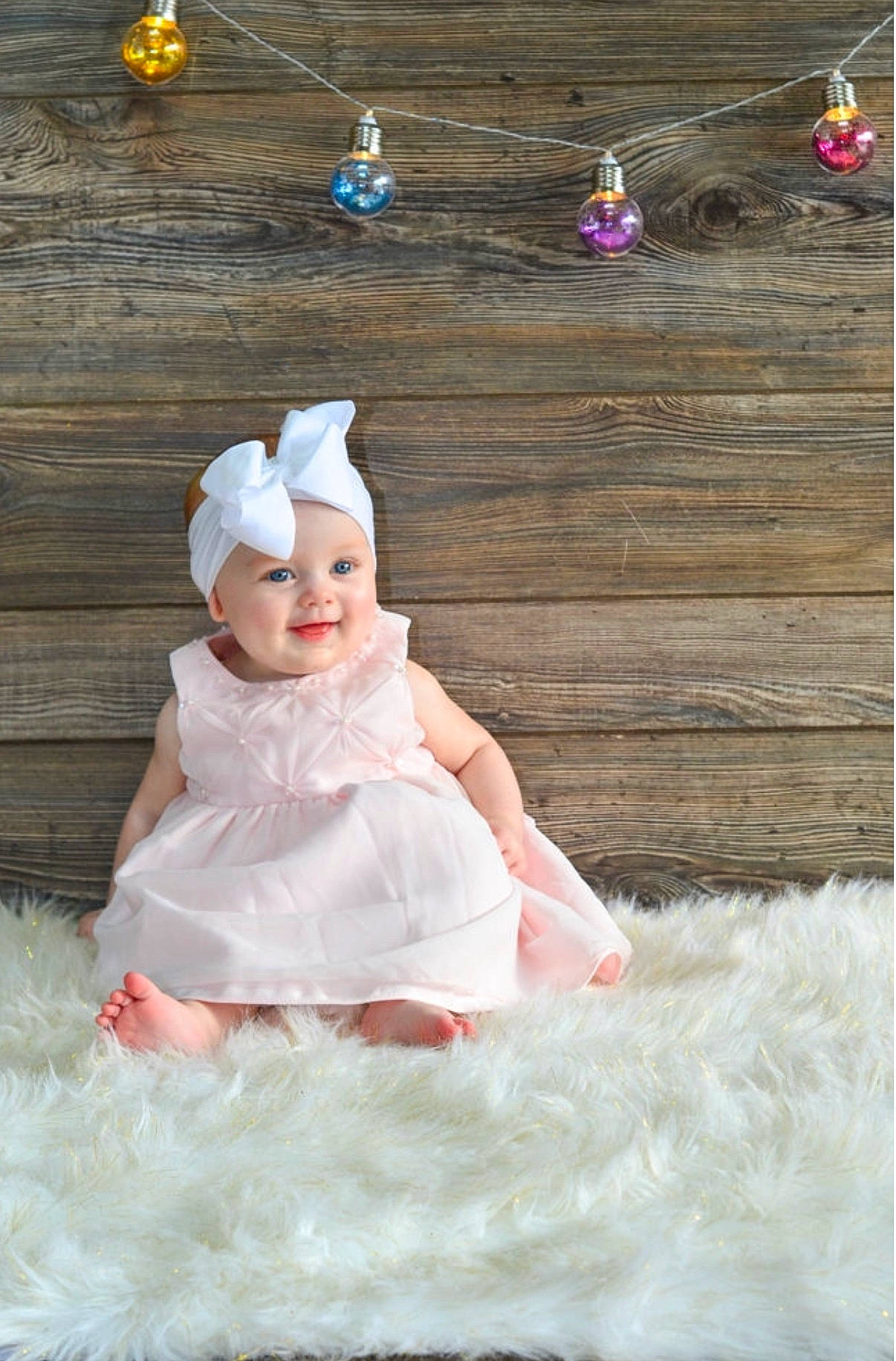 Rayna joined the competition — help win amazing prizes! baby, child, costume, dress, fashion_accessory, gown, hair_accessory, headgear, headpiece, person, petal, photo_shoot, photography, pink, skin, smile, toddler, white