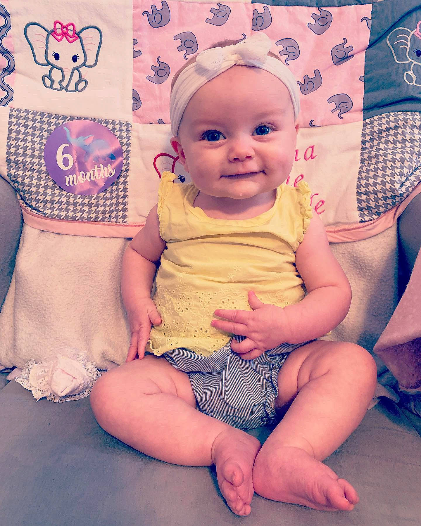 Rayna joined the competition — help win amazing prizes! baby, baby_toddler_clothing, child, diaper, joy, pattern, person, sitting, smile, toddler