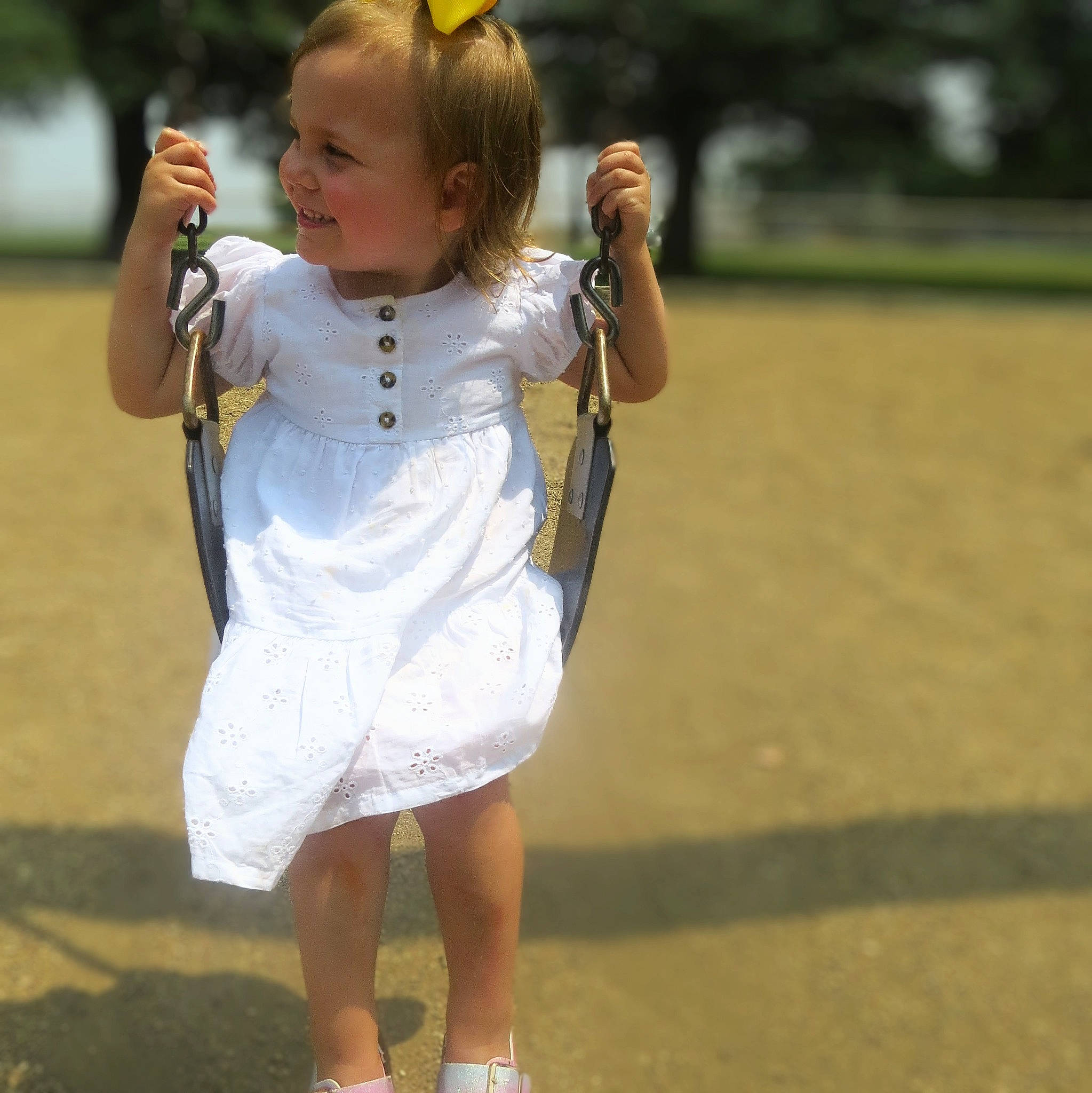 Kinzlee is registered to the contest to win money with this photo: blond, child, competition_event, day_dress, facial_expression, fun, gesture, grass, hairstyle, happy, head, human_leg, joint, leisure, person, recreation, sleeve, smile, toddler, trunk