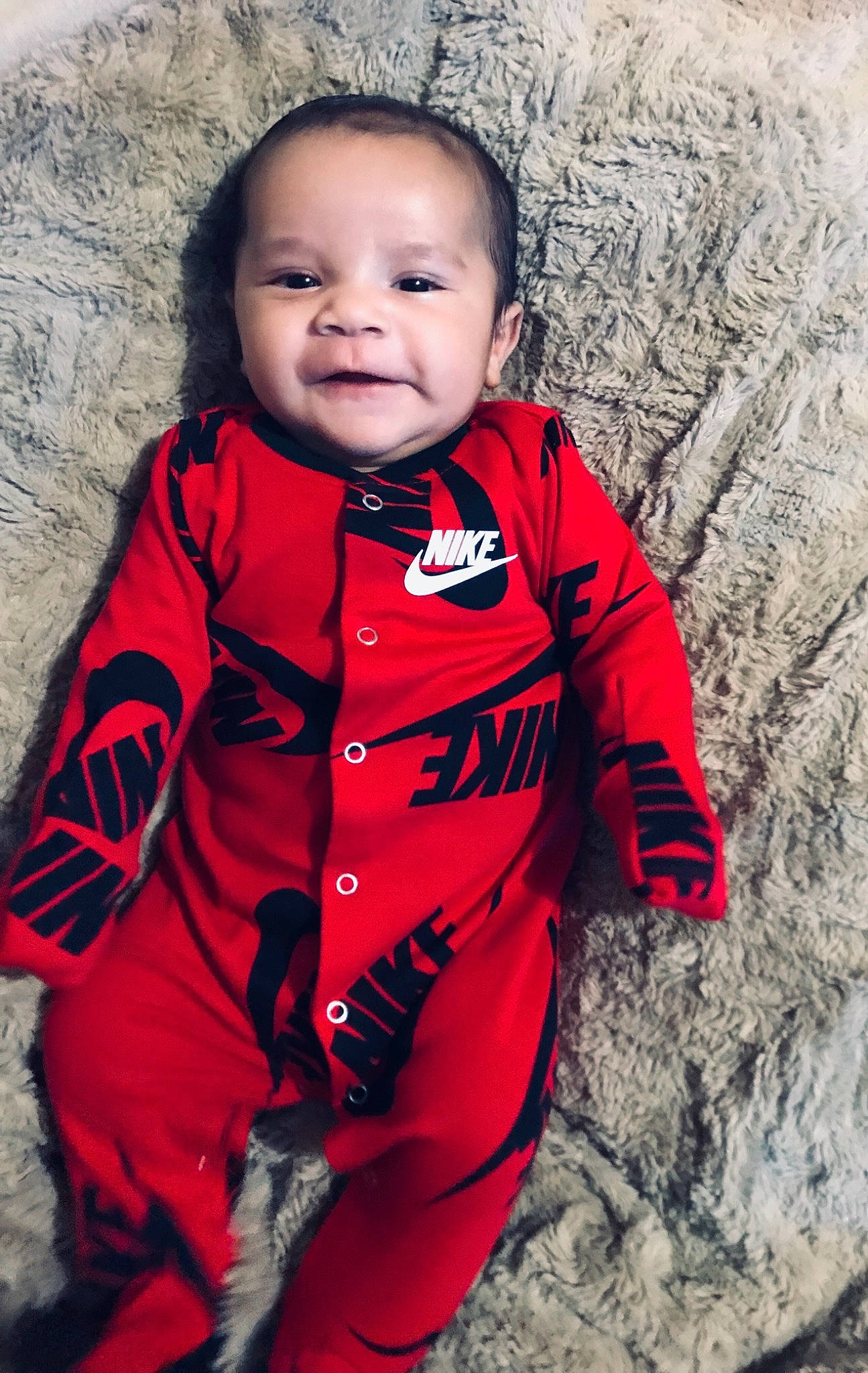 Jeremih is registered to the contest to win money with this photo: baby, cheek, child, child_model, face, head, jacket, outerwear, people, person, portrait, portrait_photography, red, skin, sleeve, smile, standing, toddler, winter
