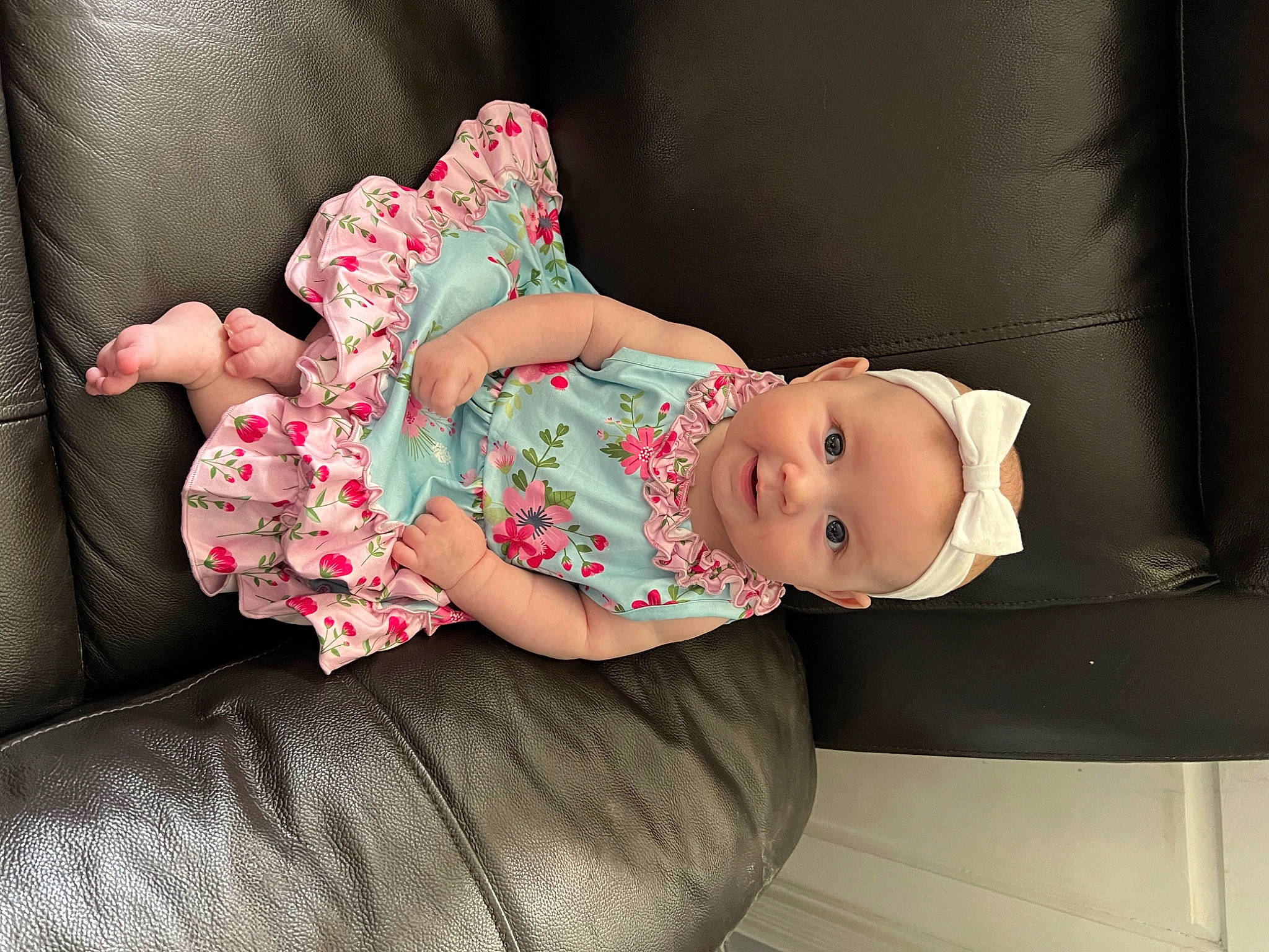 Juliana is registered to the contest to win money with this photo: baby, baby_products, baby_safety, baby_toddler_clothing, child, comfort, design, dress, hat, headwear, human_body, pattern, person, pink, product, room, sitting, skin, sleeve, smile