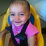 toddler, child, smile, high_chair, pink_shirt, hair_tie, indoor, seat_belt, happy, baby, person, face, cute, small_child, playful, sitting, young_child, secure, bright_colors, cheerful