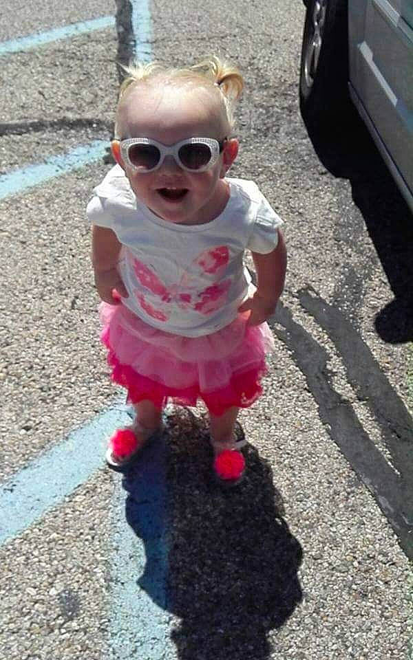 Briley is registered to the contest to win money with this photo: asphalt, baby, child, cool, dress, eyewear, glasses, headwear, person, pink, play, smile, sunglasses, toddler, vision_care