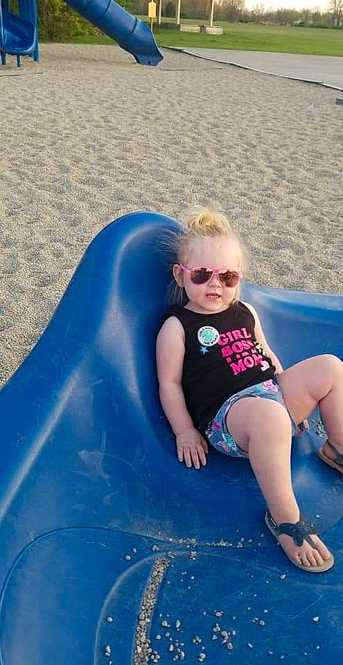 Briley is registered to the contest to win money with this photo: child, fun, headwear, leisure, outdoor_play_equipment, person, play, playground, playground_slide, public_space, recreation, smile, summer, toddler, vacation