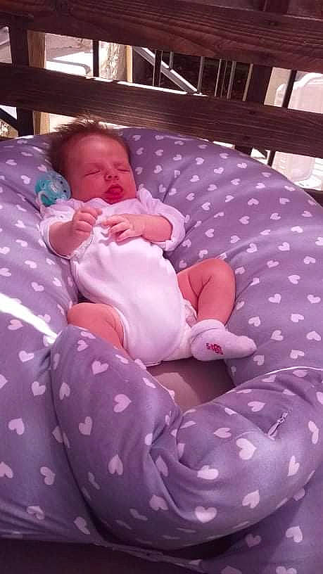 Yvane participe au concours pour gagner de l'argent avec cette photo : baby, baby_products, baby_safety, baby_sleeping, baby_toddler_clothing, cheek, child, comfort, foot, human_body, linens, mammal, pattern, person, pink, product, purple, sitting, skin, textile