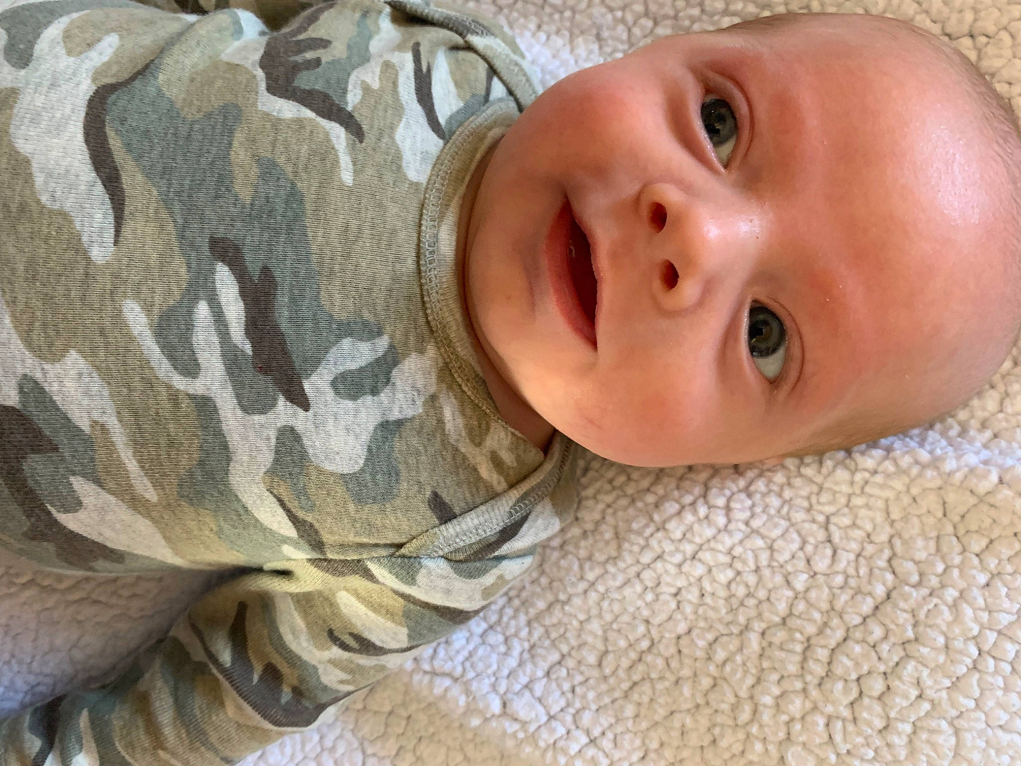 Jaydan joined the competition — help win amazing prizes! baby, baby_toddler_clothing, cheek, child, comfort, eyebrow, eyelash, face, happy, iris, linens, lip, military_camouflage, nose, pattern, person, skin, sleeve, smile, textile