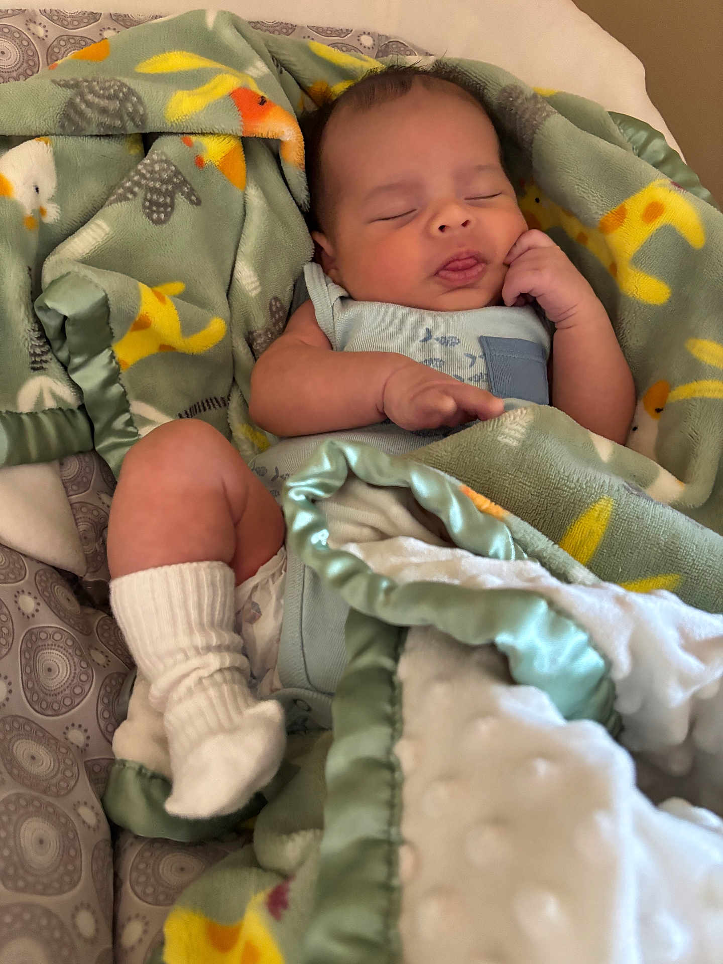 Jaylen is registered to the contest to win money with this photo: baby, sleeping, blanket, sock, infant, cozy, cute, soft, wrapped, child, resting, peaceful, indoors, fabric, comfort, newborn, pajamas, cute_face, nap, warm