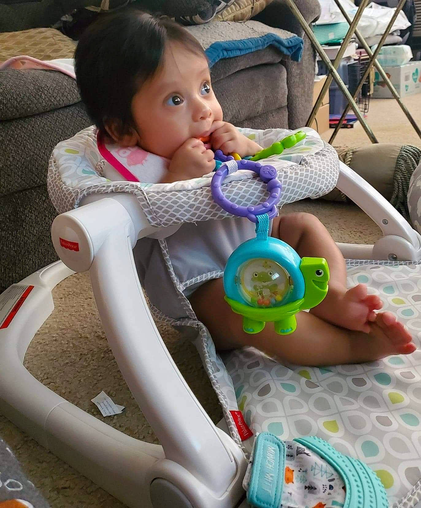 Lorelai is registered to the contest to win money with this photo: auto_part, automotive_wheel_system, baby, baby_products, baby_toddler_clothing, child, comfort, finger, fun, happy, leisure, person, photograph, play, recreation, skin, snapshot, steering_wheel, tire, toddler