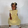 Théa a rejoint le concours — aidez-le/la à gagner de superbes lots ! bow, child, cute, fashion, footwear, girl, hair, happy, headband, indoor, person, portrait, sandals, sitting, smile, stool, tile_floor, toddler, white_wall, yellow_dress