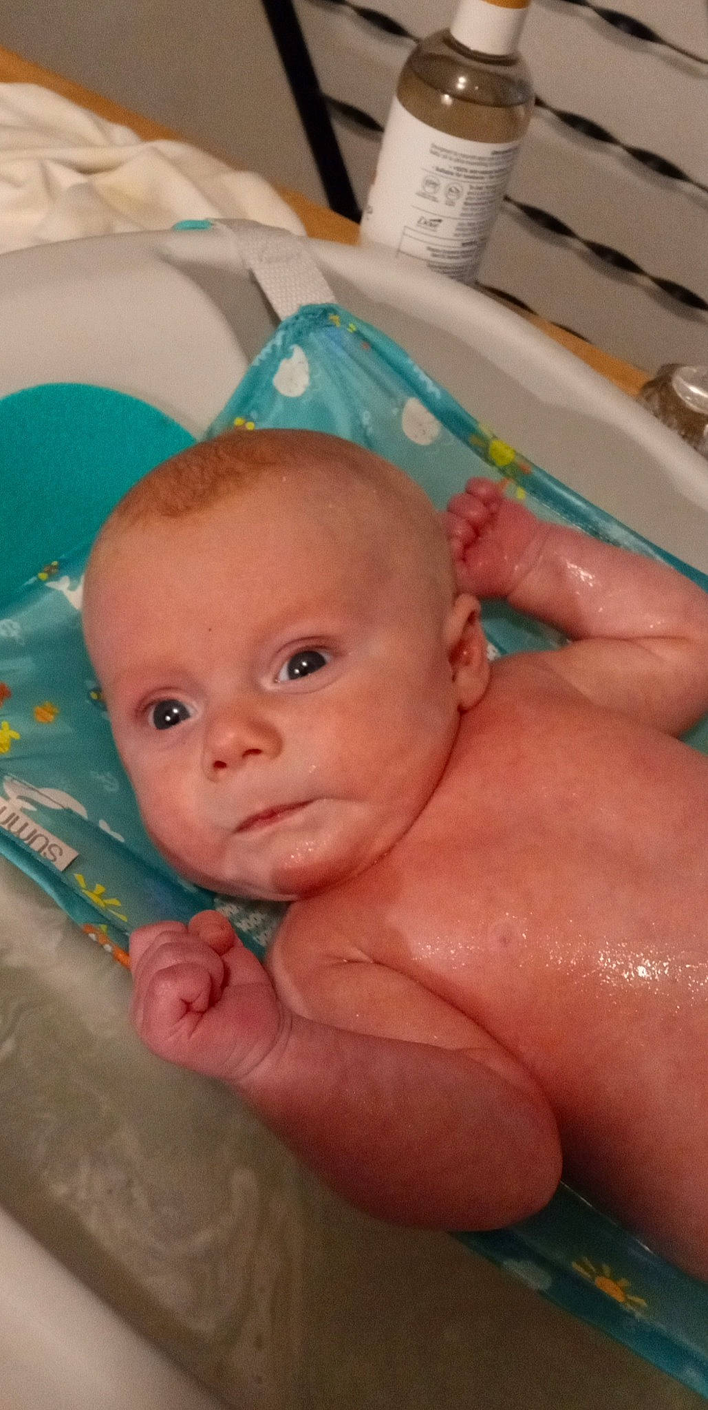 Everett joined the competition — help win amazing prizes! baby, baby_bathing, bathing, bathtub, cheek, chin, eye, eyebrow, face, fluid, gesture, head, iris, mouth, nose, person, skin, smile, thumb, toddler