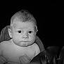baby, infant, face, portrait, skin, blanket, hand, expression, curious, monochrome, black_and_white, soft, child, young, cute, closeup, person, head, eyes, naked_shoulders