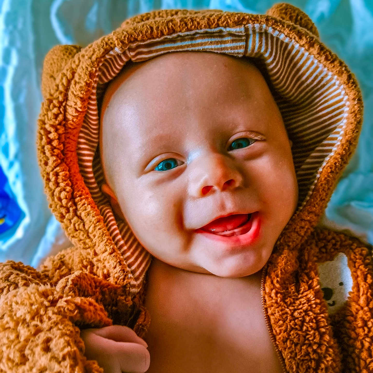 Lennix is registered to the contest to win money with this photo: baby, babylaughing, bodypart, bonnet, cap, clothing, face, finger, hand, happy, hat, head, hood, newborn, person, photography, portrait, smile