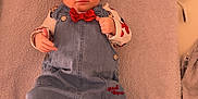 Lou participe au concours pour gagner de l'argent avec cette photo : airplane, baby, baby_girl, child, clothing, curious, cute, denim_dress, headband, home, indoors, infant, lying_down, person, pillow, playful, portrait, red_bow, soft_texture, towel